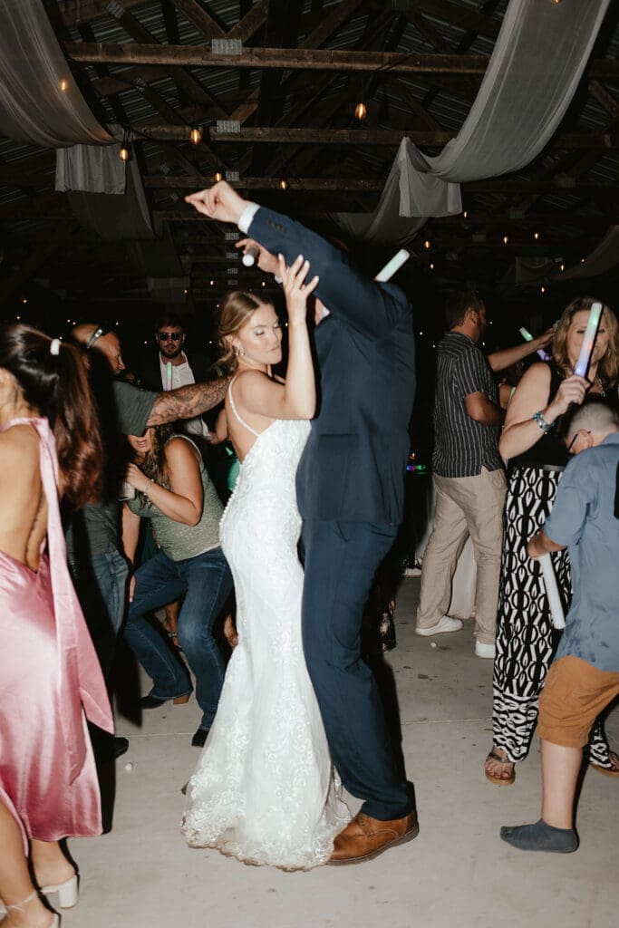 Bride and groom dance on the dance floor during their wedding reception
