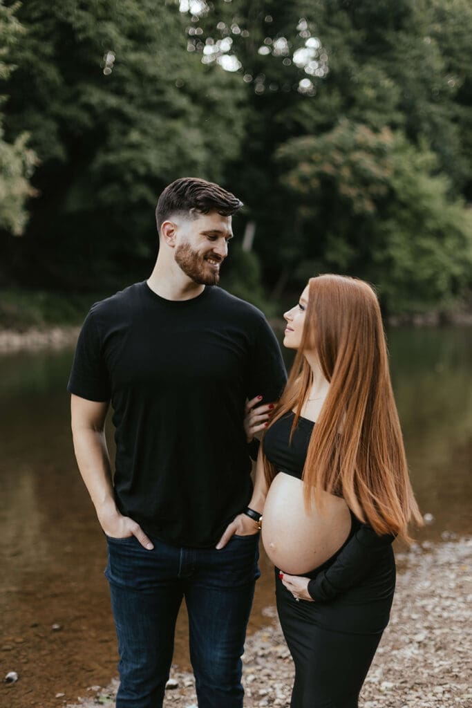Outdoor maternity photos by a creek