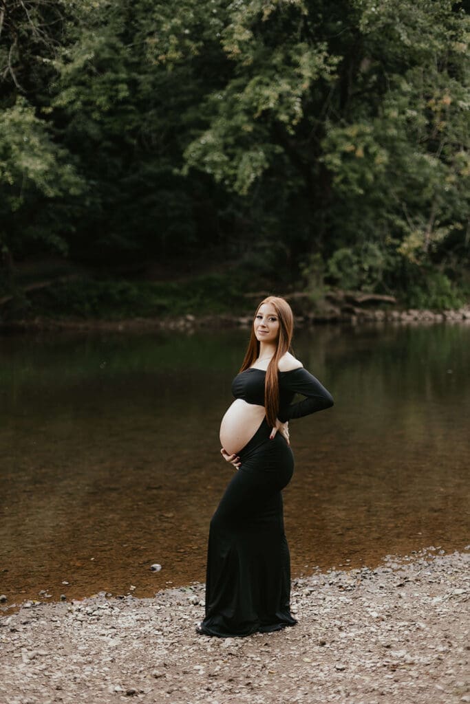 Portrait of a pregnant woman touching her belly