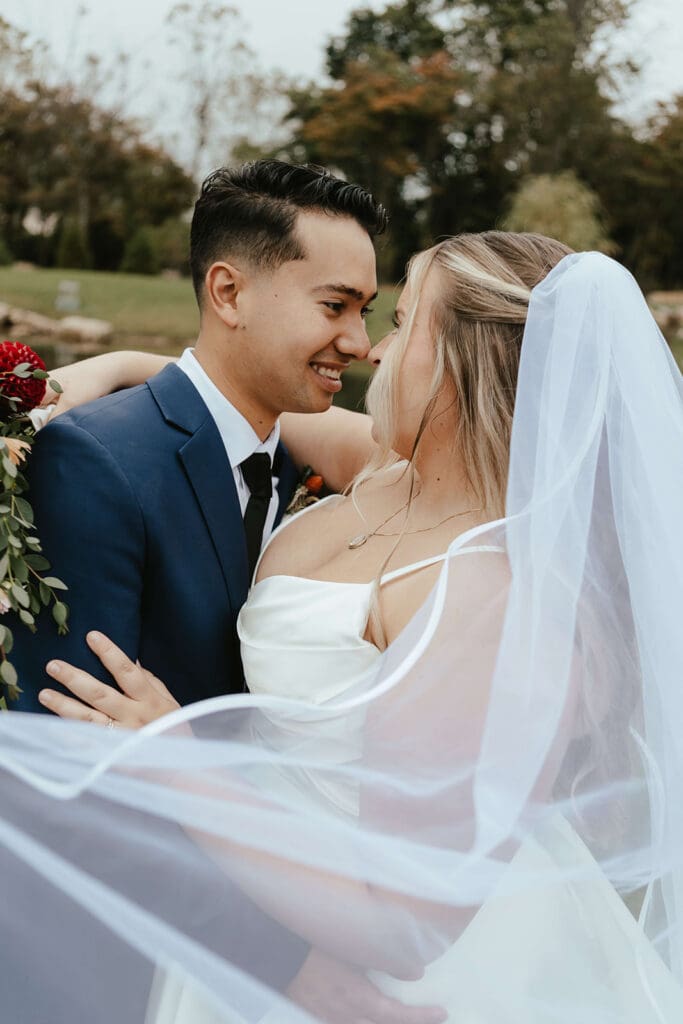 Bride and groom candid portrait outdoors