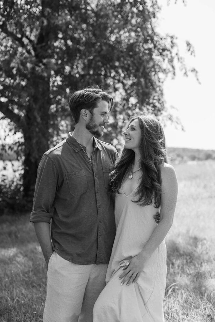Engaged couple lovingly gaze at each other
