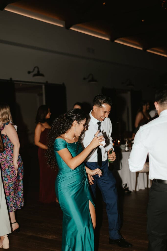 Groom dancing with wedding guest