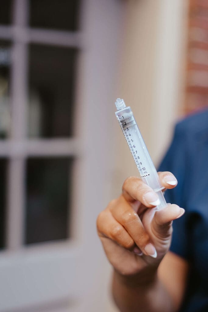 Close up of nurse's syringe