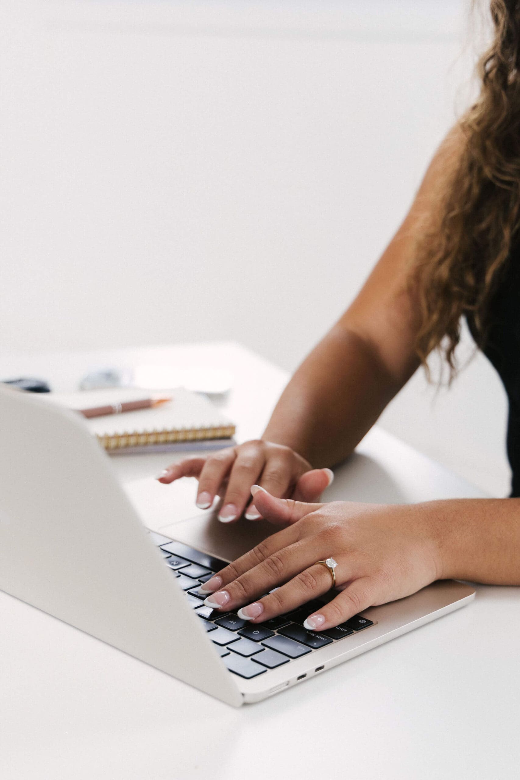 Wedding content creator editing short-form videos on a computer